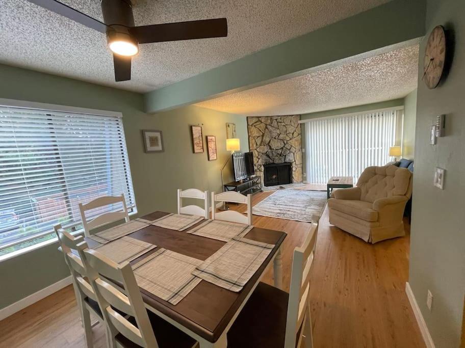 a dining room with a table and chairs and a living room at Livable A in kirkland in Kirkland