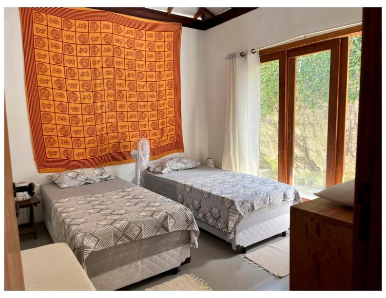 Postel nebo postele na pokoji v ubytování Casa com quintal