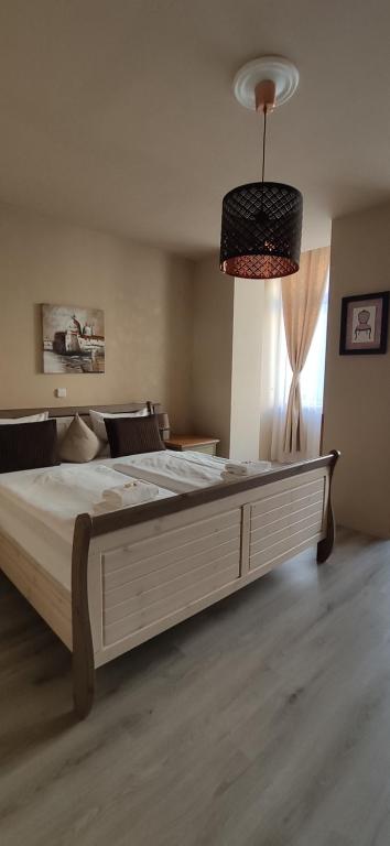Postel nebo postele na pokoji v ubytování Hotel Augustus et Otto
