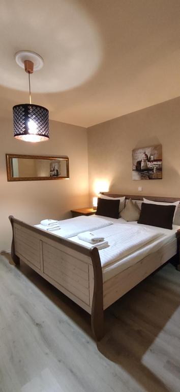 Postel nebo postele na pokoji v ubytování Hotel Augustus et Otto