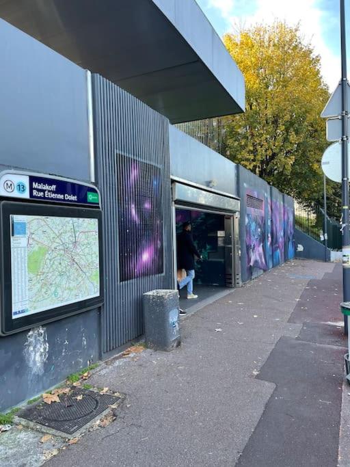 a building with graffiti on the side of it at Studio de charme à 2 pas de Paris in Malakoff