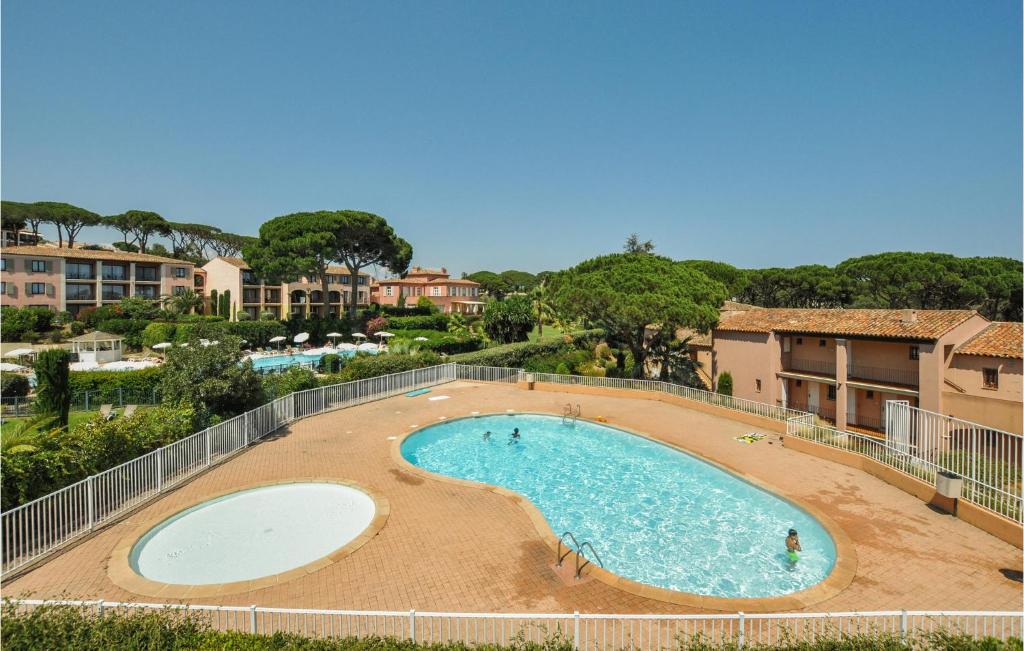 a large swimming pool in a resort at Awesome Apartment In Sainte-Maxime in Sainte-Maxime