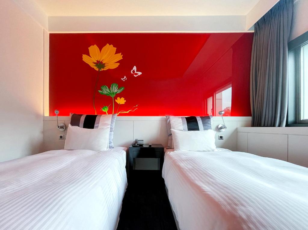 Postel nebo postele na pokoji v ubytování Guide Hotel Kaohsiung Liuhe