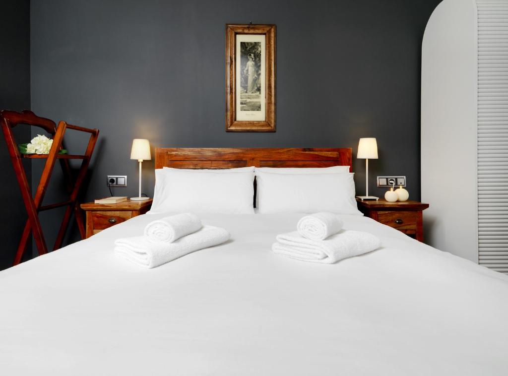 Postel nebo postele na pokoji v ubytování Fewdays Barcelona Apartments