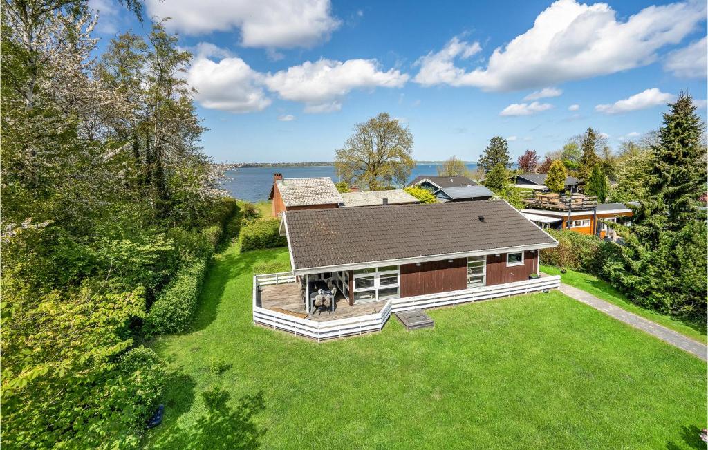 an aerial view of a house with a dog on a lawn at 3 Bedroom Nice Home In Middelfart in Middelfart