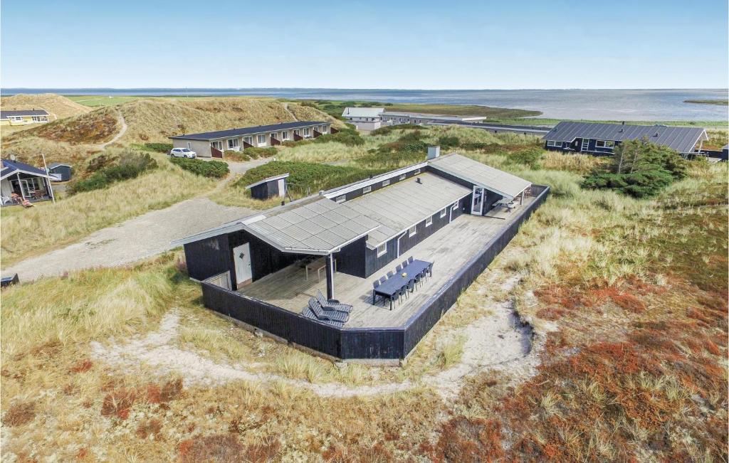 an overhead view of a house on a beach at Lovely Home In Hvide Sande With Private Swimming Pool, Can Be Inside Or Outside in Havrvig
