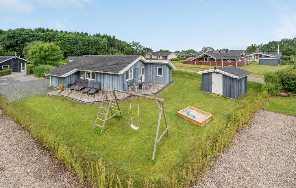 an aerial view of a yard with a swing at Awesome Home In Juelsminde With Sauna in Sønderby