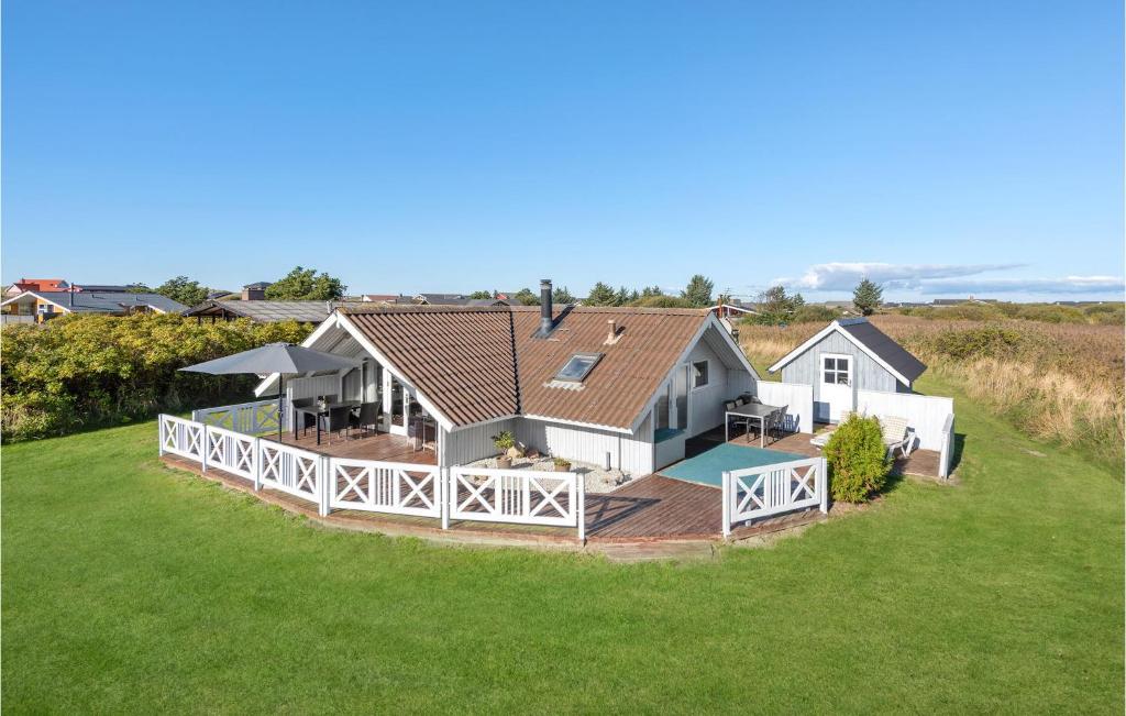 an aerial view of a house with a large yard at 3 Bedroom Beautiful Home In Rm in Bolilmark