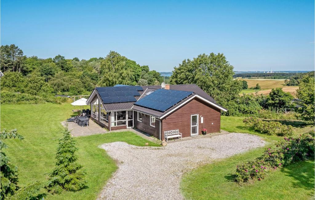 a house with solar panels on top of it at Amazing Home In Knebel With Private Swimming Pool, Can Be Inside Or Outside in Skødshoved Strand