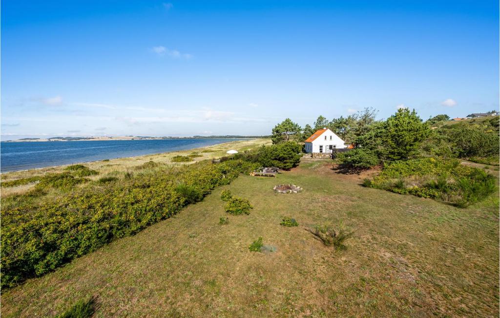 an aerial view of a house on the shore of the ocean at Awesome Home In Knebel With Kitchen in Knebel