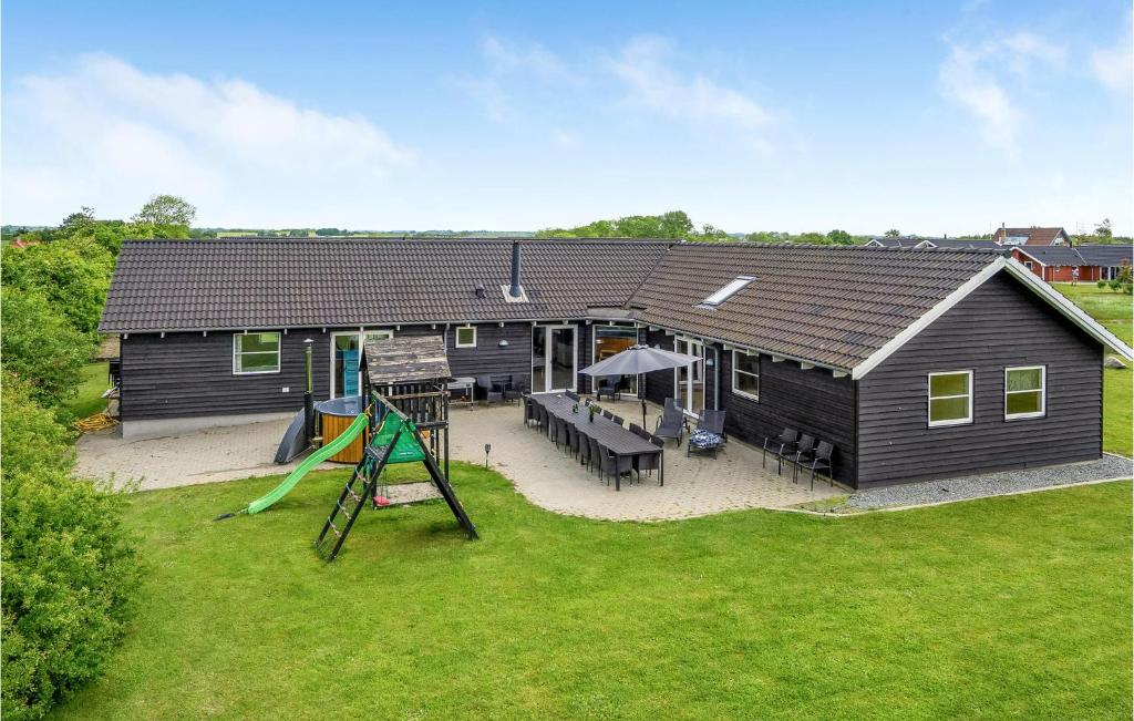 een luchtzicht op een huis met een speeltuin bij Gorgeous Home In Sydals With Indoor Swimming Pool in Høruphav
