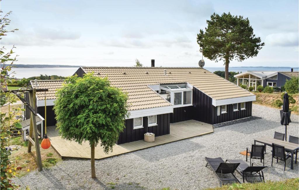 an aerial view of a house with a roof at Stunning Home In Ebeltoft With 4 Bedrooms, Private Swimming Pool And Indoor Swimming Pool in Ebeltoft