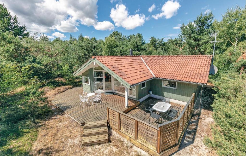an overhead view of a green cabin with a deck at Three-Bedroom Holiday Home In Aakirkeby in Vester Sømarken
