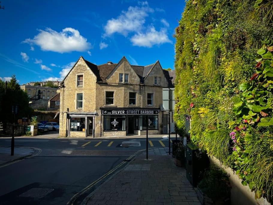 a street with a building on the side of the road at Period apartment, great views, in heart of town. in Bradford on Avon