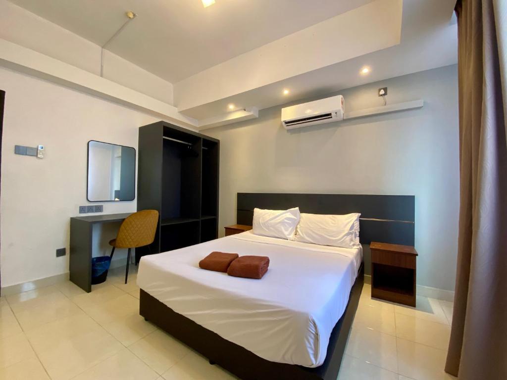 Postel nebo postele na pokoji v ubytování Sumai Hotel Apartment