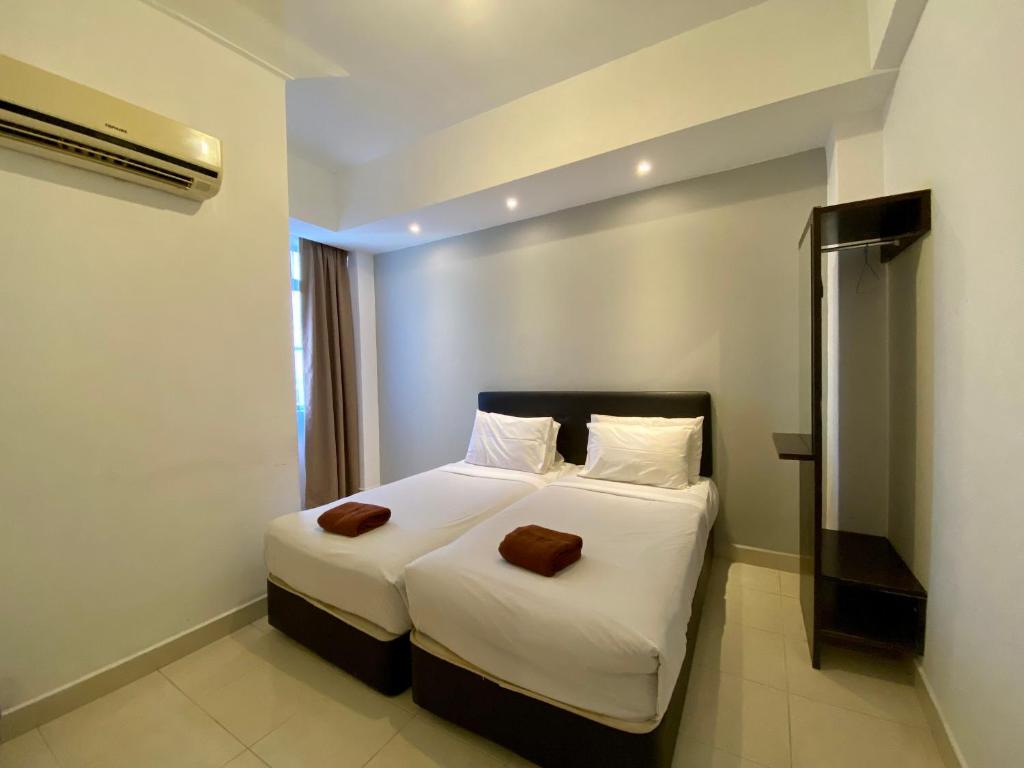 Postel nebo postele na pokoji v ubytování Sumai Hotel Apartment
