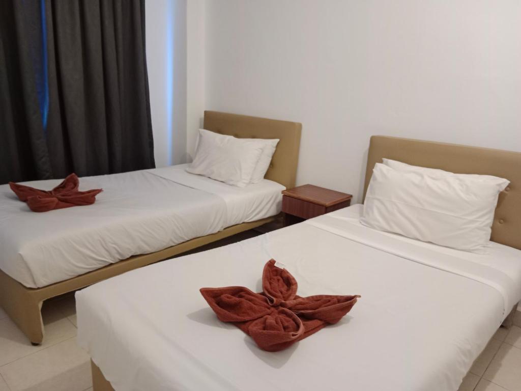 Postel nebo postele na pokoji v ubytování Sumai Hotel Apartment