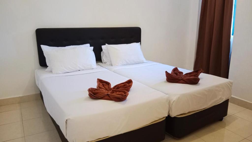Postel nebo postele na pokoji v ubytování Sumai Hotel Apartment