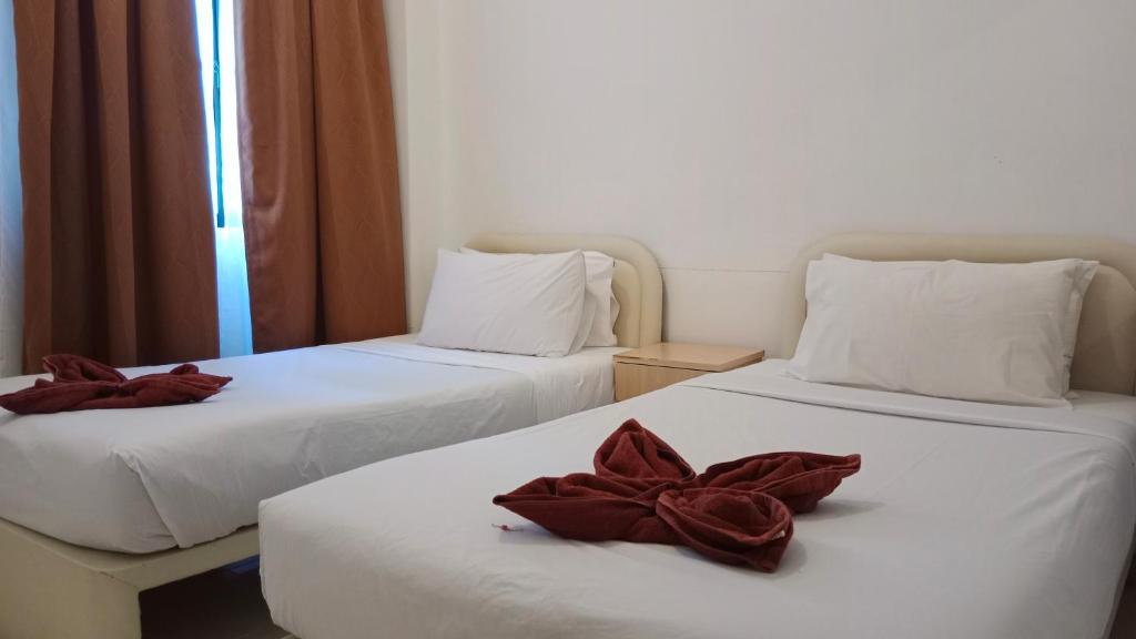 Postel nebo postele na pokoji v ubytování Sumai Hotel Apartment