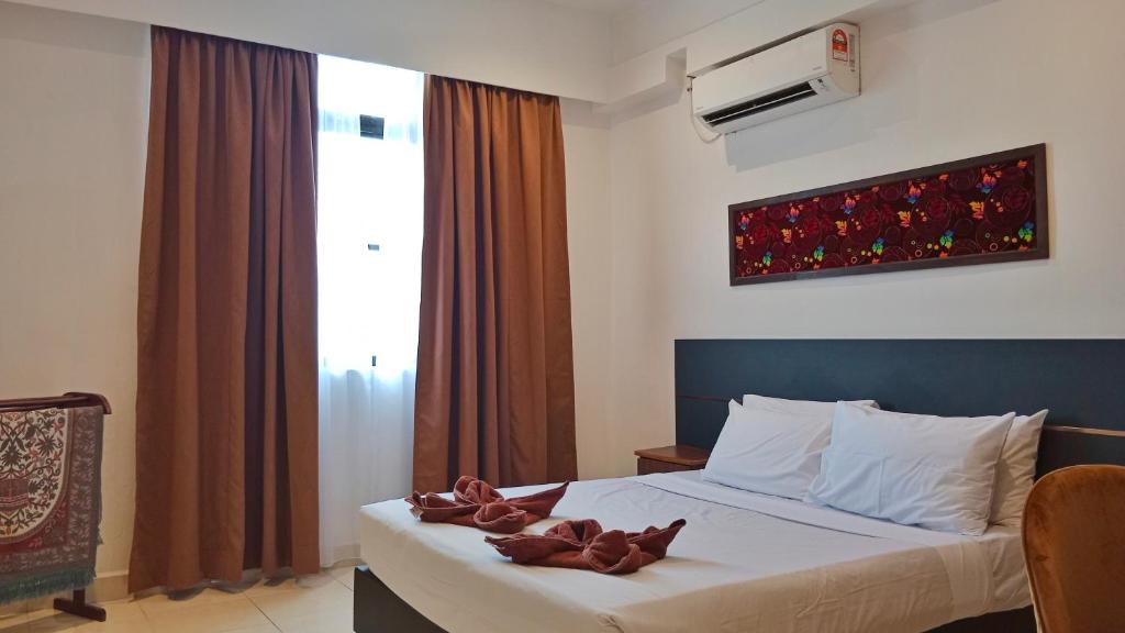 Postel nebo postele na pokoji v ubytování Sumai Hotel Apartment