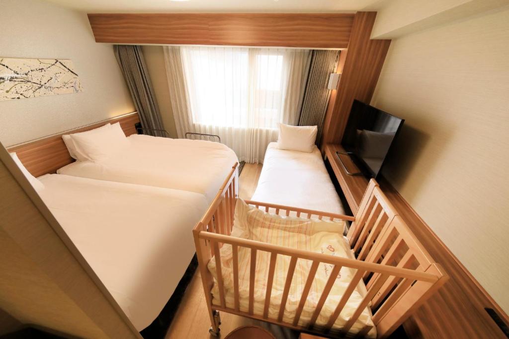 Postel nebo postele na pokoji v ubytování Richmond Hotel Nagoya Shinkansen-guchi