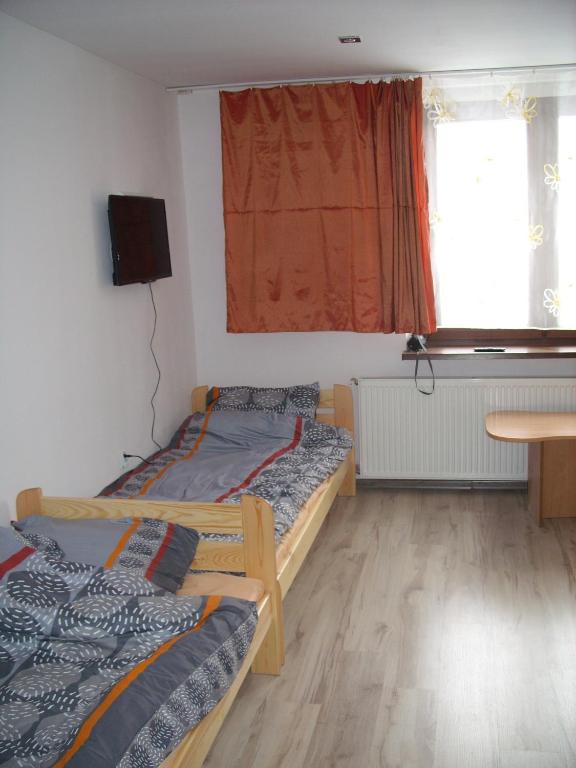 Postel nebo postele na pokoji v ubytování Pokoje Typu Studio Sosnowiec