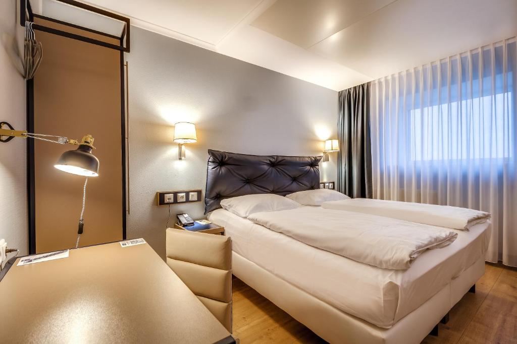 Postel nebo postele na pokoji v ubytování Congress Hotel Chemnitz