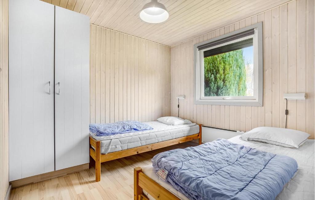 Postel nebo postele na pokoji v ubytování Holiday Home Fridavej Grenaa Xii
