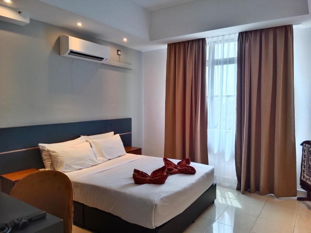 Postel nebo postele na pokoji v ubytování Sumai Hotel Apartment