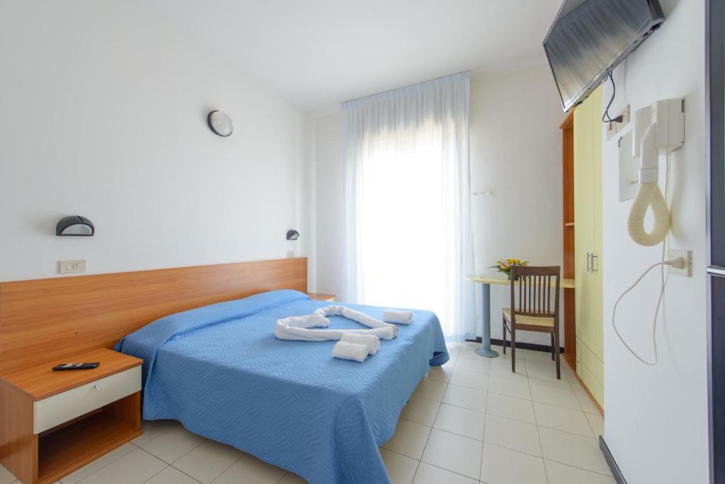 Postel nebo postele na pokoji v ubytování Hotel Paloma Beach Front Chiringuitos Time