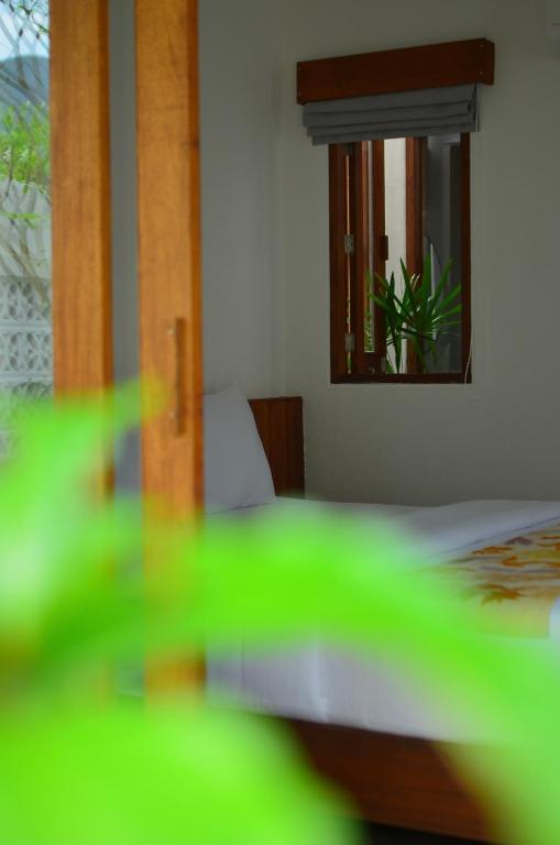 Postel nebo postele na pokoji v ubytování Phang Nga Origin Hotel