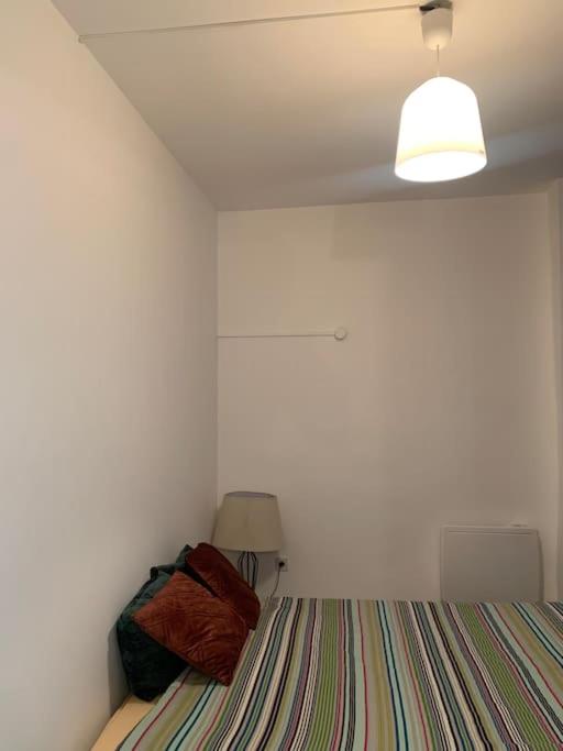 Posteľ alebo postele v izbe v ubytovaní Charmant appartement 2 chambres dans le centre historique