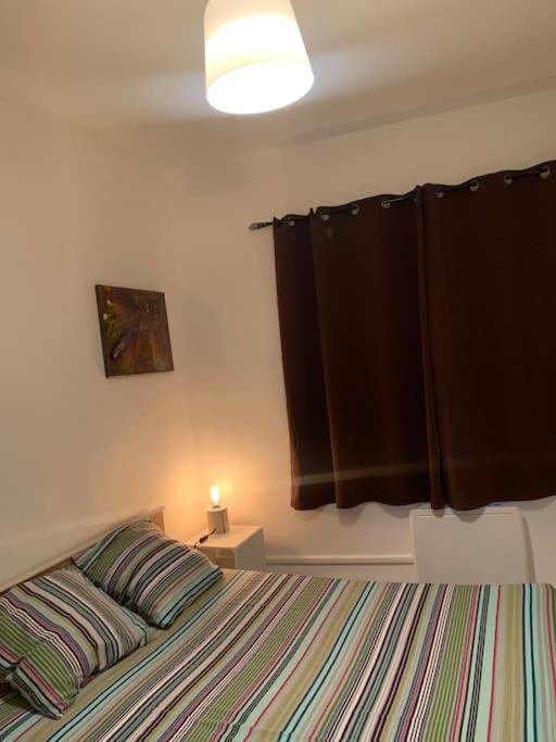 Posteľ alebo postele v izbe v ubytovaní Charmant appartement 2 chambres dans le centre historique