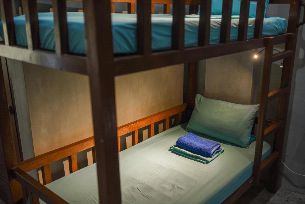 Voodi või voodid majutusasutuse Sinag Hostel toas