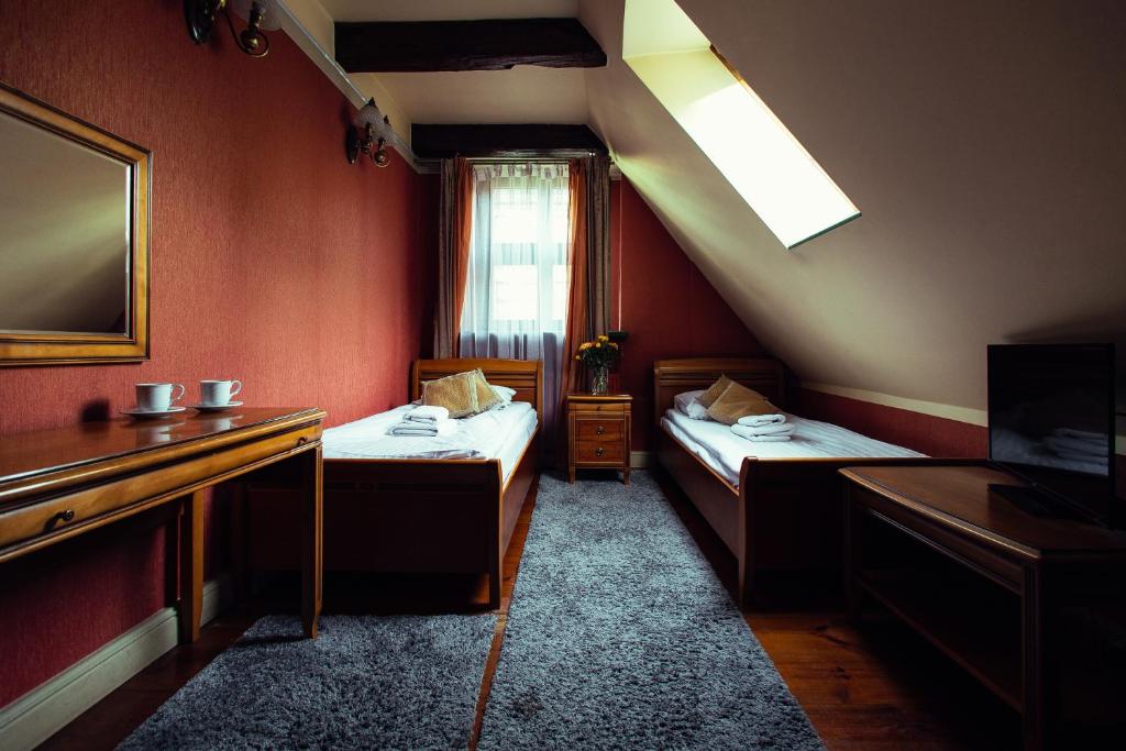Postel nebo postele na pokoji v ubytování Heban Hotel