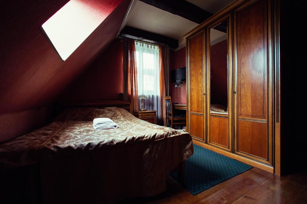 Postel nebo postele na pokoji v ubytování Heban Hotel