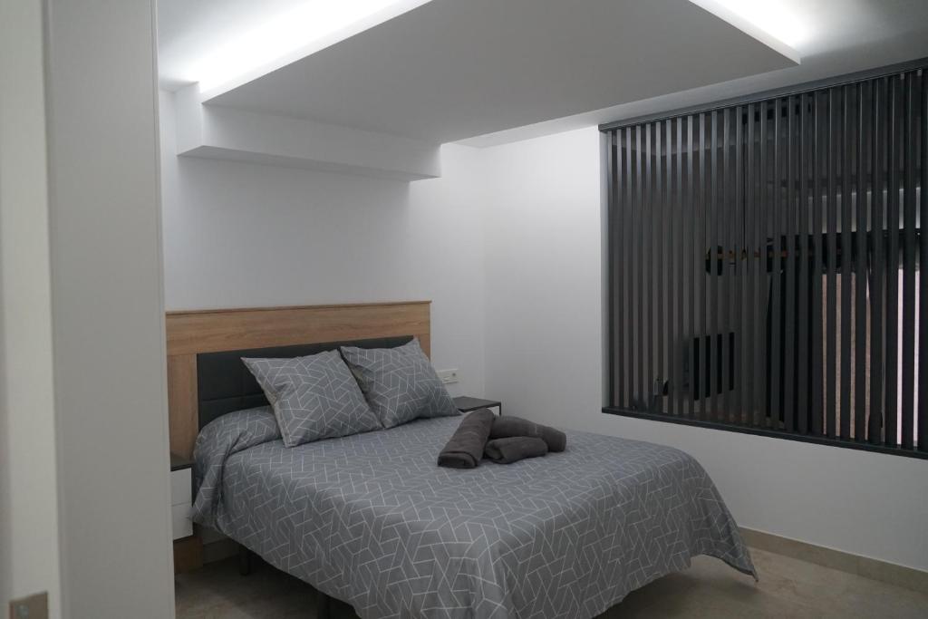 Postel nebo postele na pokoji v ubytování Apartamento Turistico Hermanos Infantes