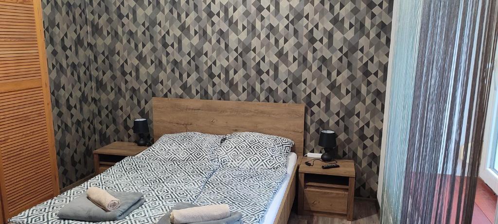 Posteľ alebo postele v izbe v ubytovaní Lugas Apartman