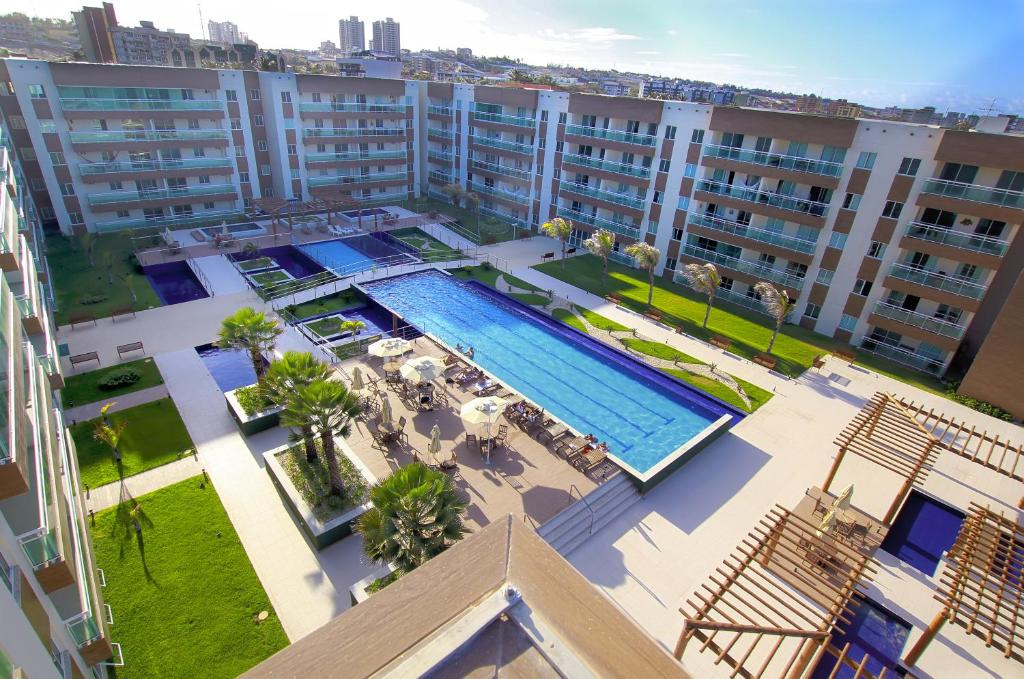 an overhead view of an apartment complex with a swimming pool at Sun Residence in Fortaleza