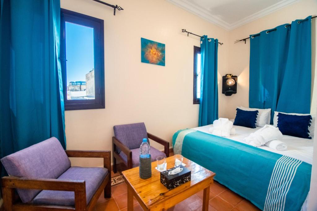 Postel nebo postele na pokoji v ubytování ArtHouse Cinema Hotel