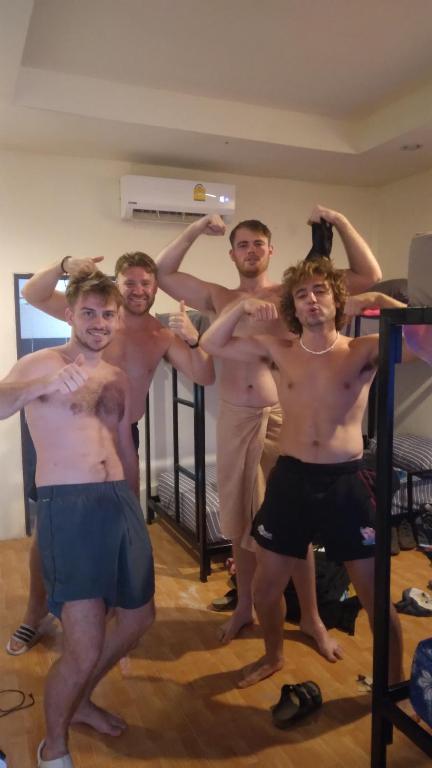 a group of young men standing in a room at Boy Scouts Homestay in Ban Nua