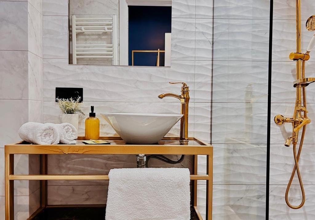 a bathroom with a sink and a shower at 360 Tbilisi in Tbilisi City