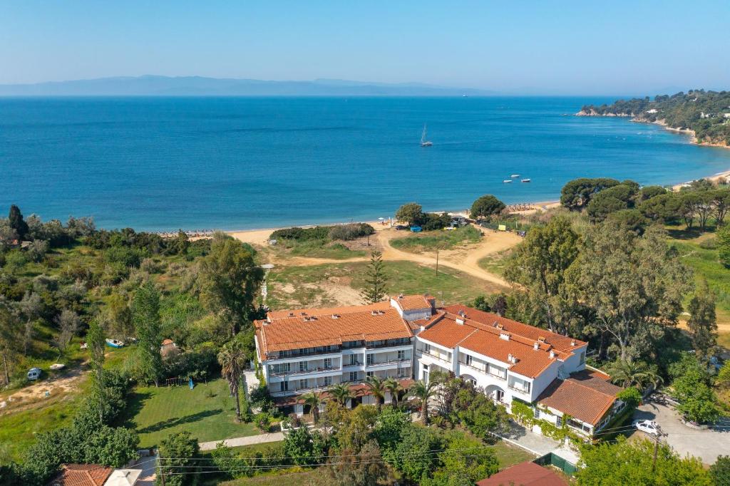an aerial view of a building on a beach at Arco Beach Hotel in Agia Paraskevi