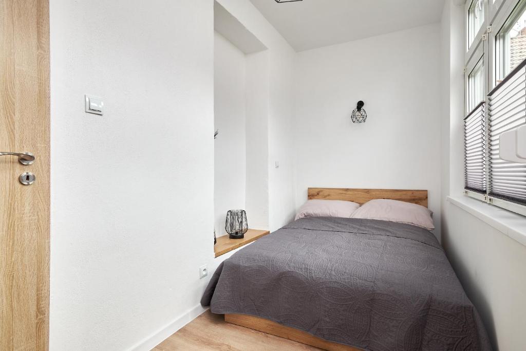 Posteľ alebo postele v izbe v ubytovaní Apartamenty u Bratków