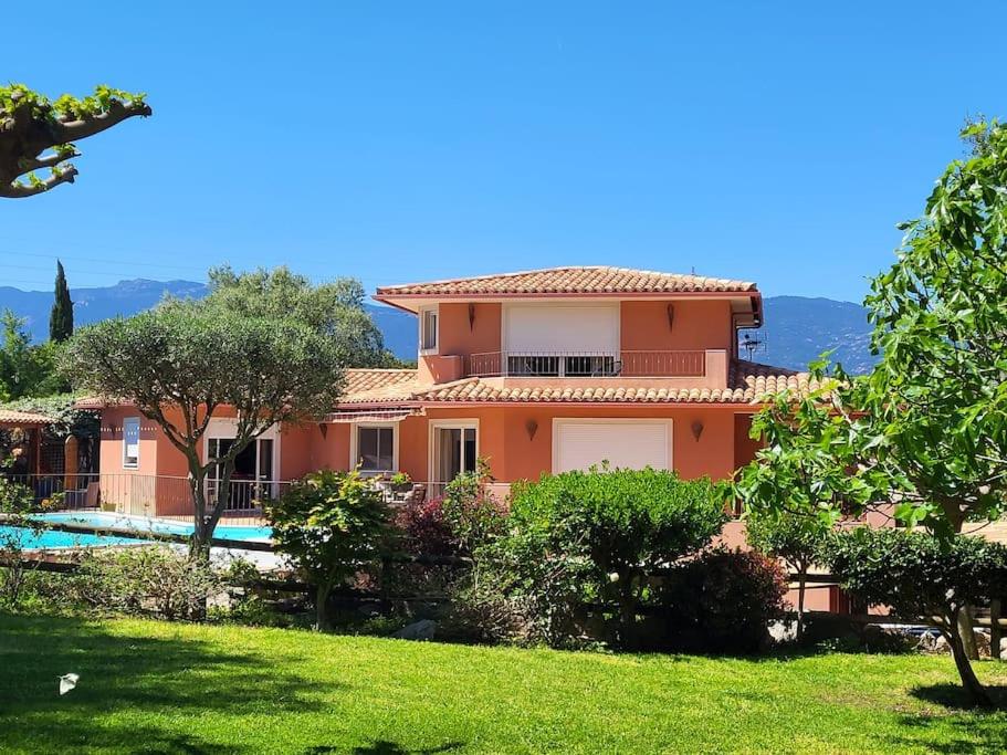 a house with a swimming pool and a yard at Casa Marcelli 5 in Porto-Vecchio