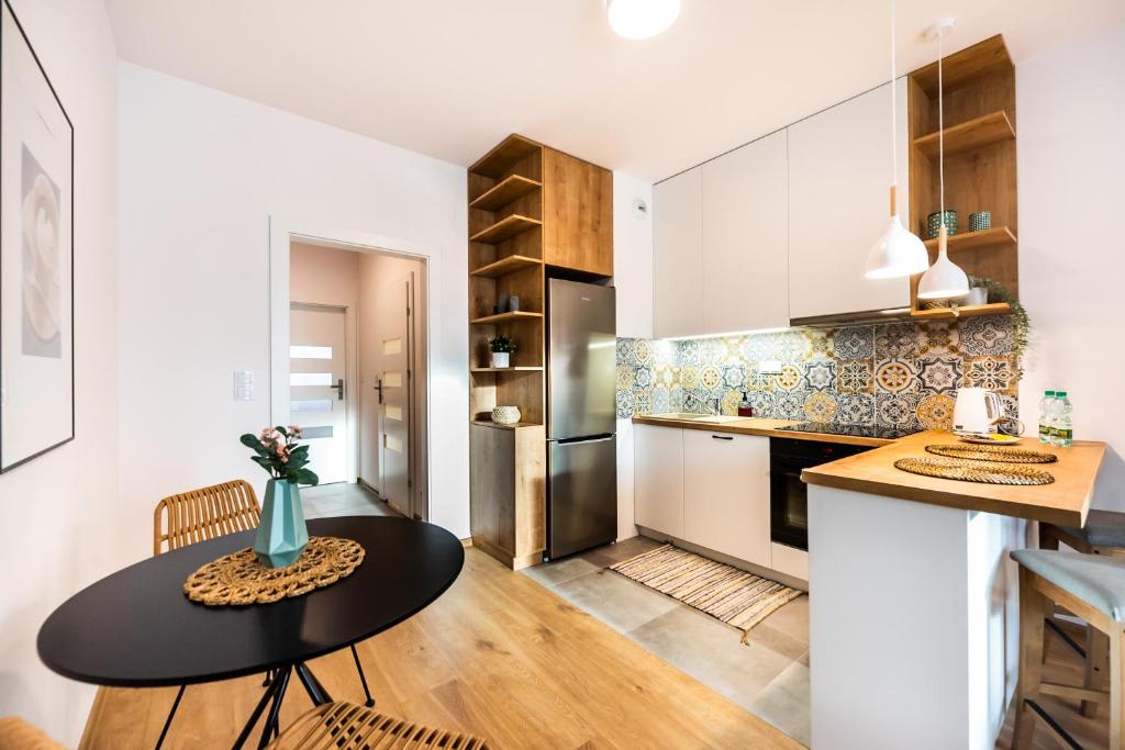 Kuchyňa alebo kuchynka v ubytovaní Mokotów Passion Apartment