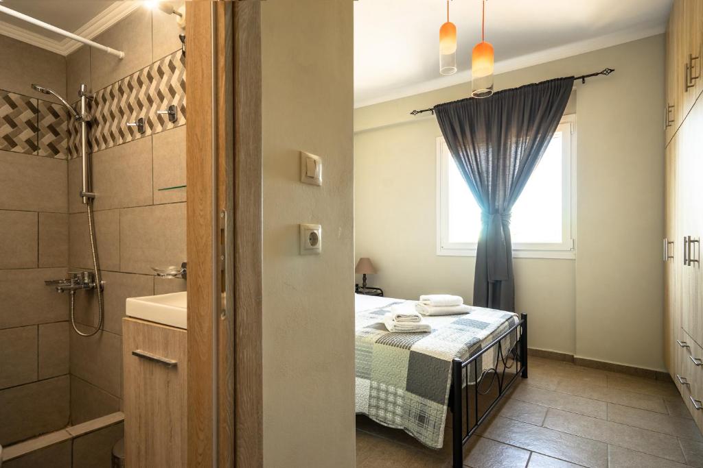 A bed or beds in a room at Zoi apartment