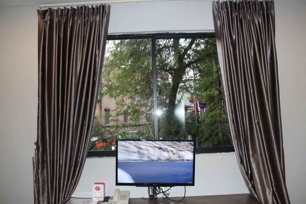 TV a/nebo společenská místnost v ubytování Ostro Hotel