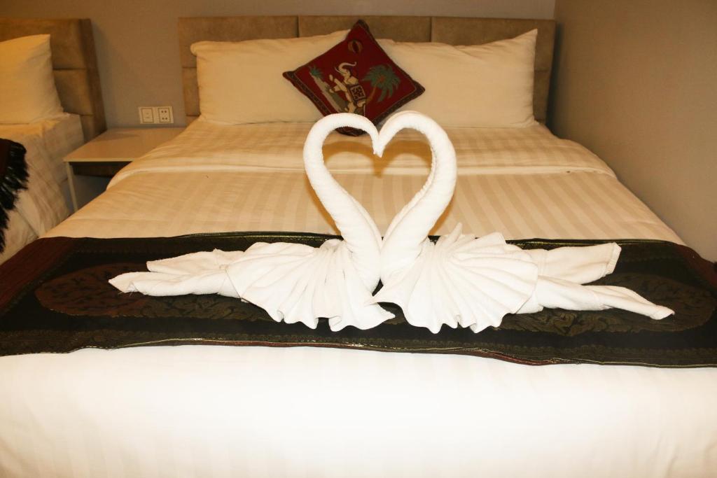 Postel nebo postele na pokoji v ubytování Ostro Hotel