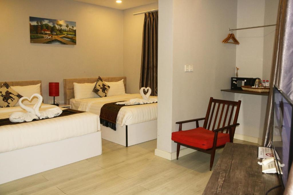 Postel nebo postele na pokoji v ubytování Ostro Hotel